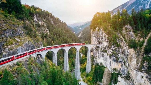 Slow training crossing bridge in Switzerland